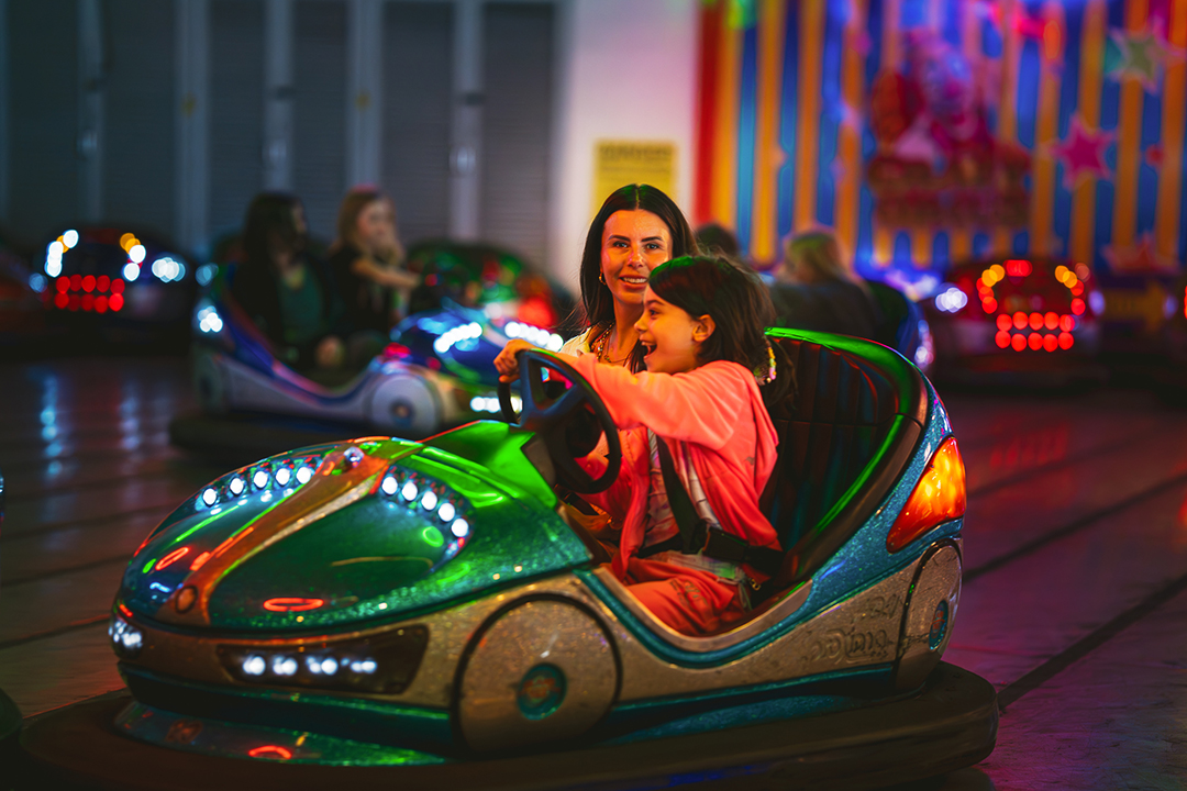 A mother and child on the dodgems
